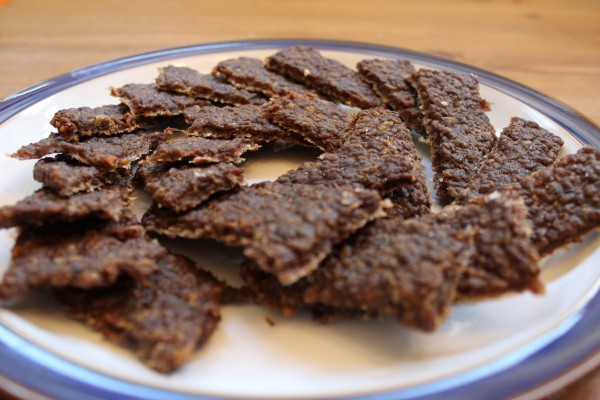 jerky from ground beef arranged on a plate after drying