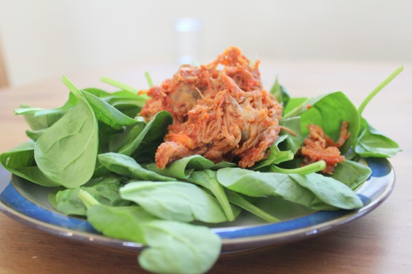 pulled pork on spinach
