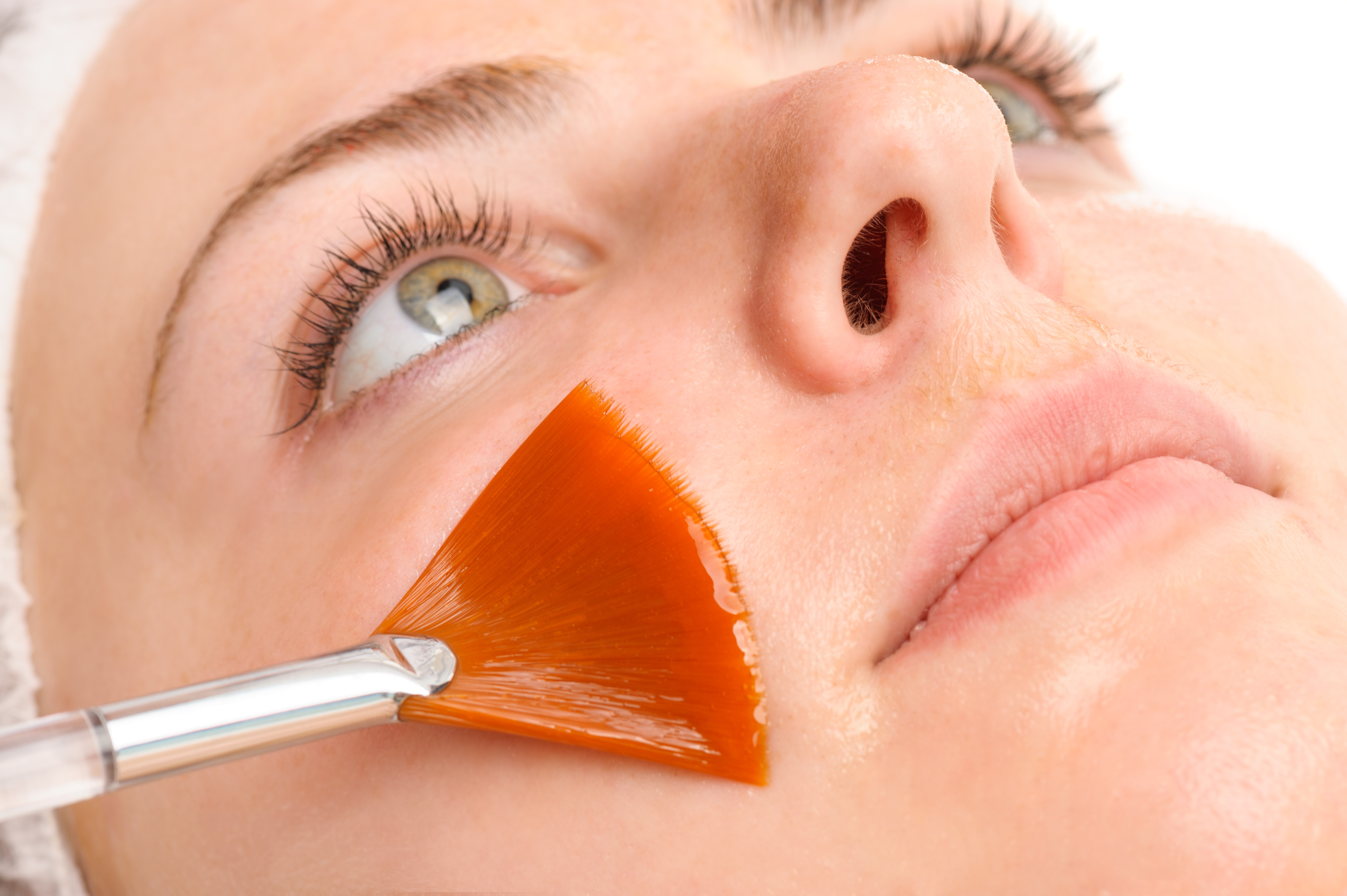 Brush applying chemical facial peel